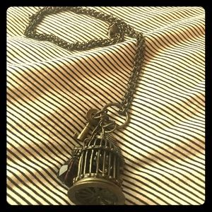Bronze birdcage necklace with long chain
